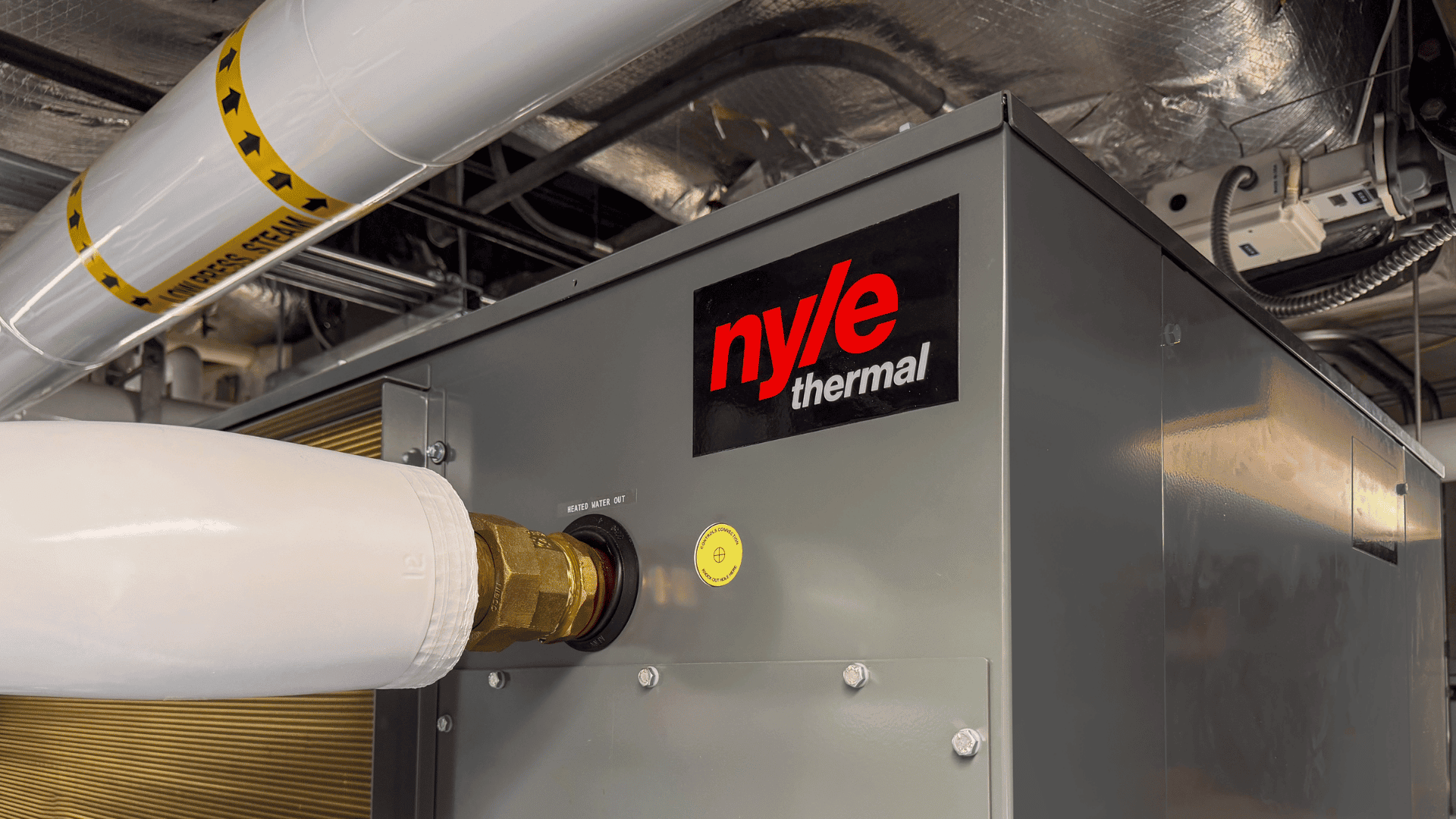 Nyle thermal water heating system with piping and control panel.